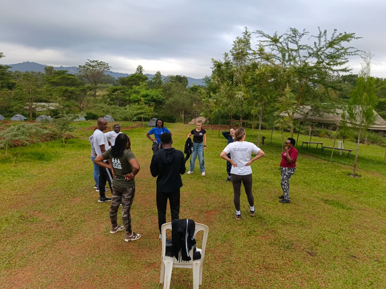 Facilitators and participants gathered outdoors during a field exercise